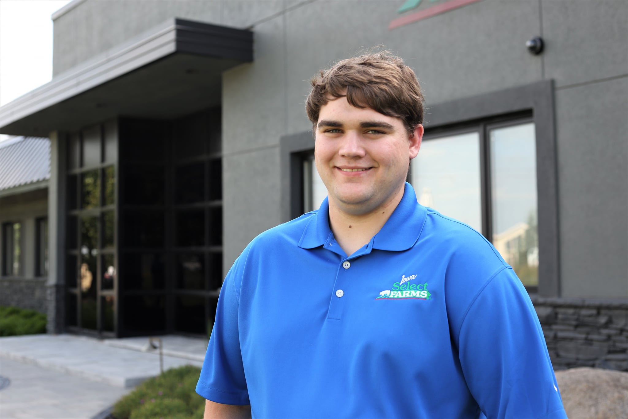 Caleb poses in his intern polo.