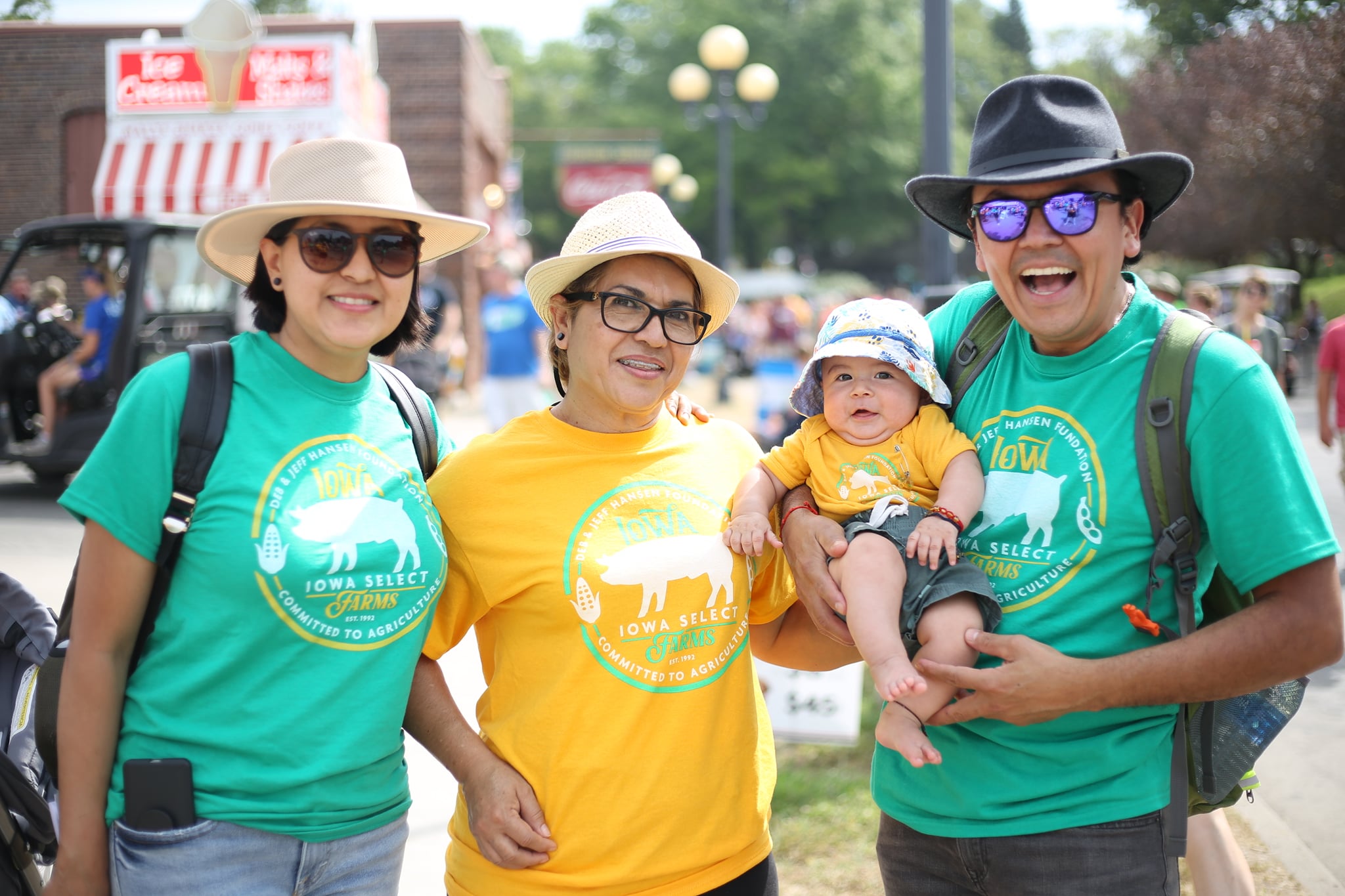 A family poses for a picture before exploring the state fair.