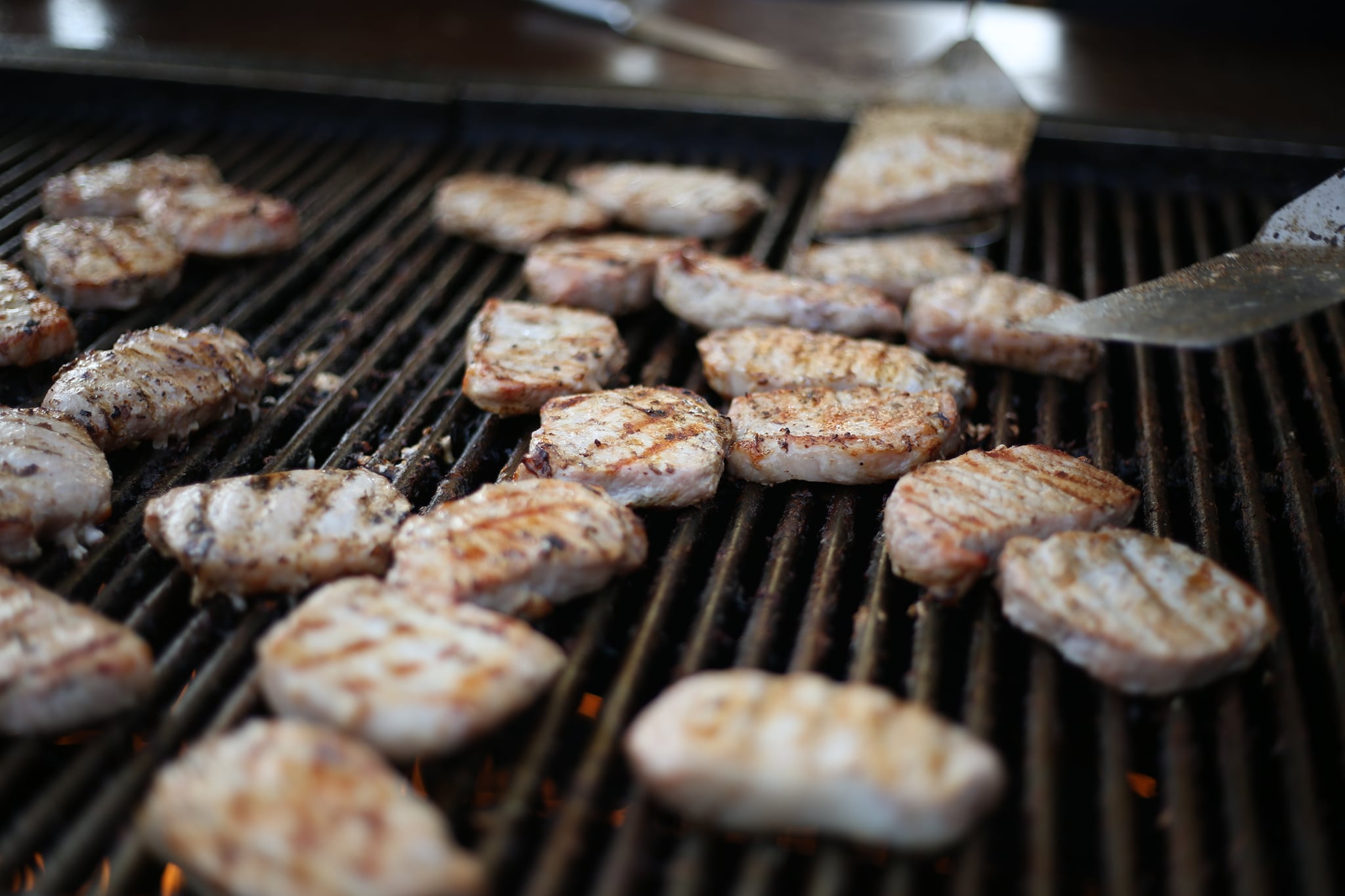 Pork sizzles on the grill