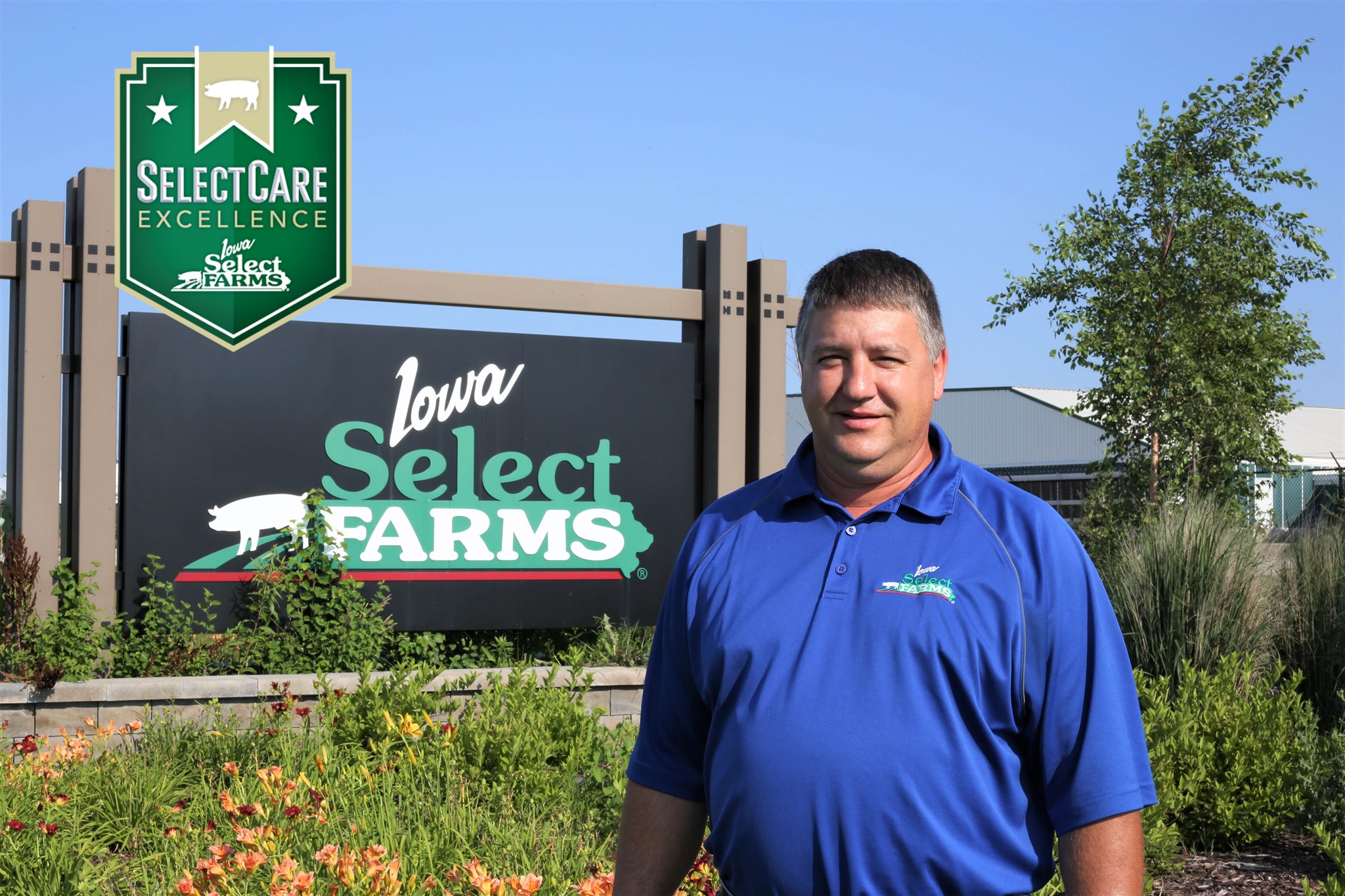 Don stand in front of an Iowa Select sign