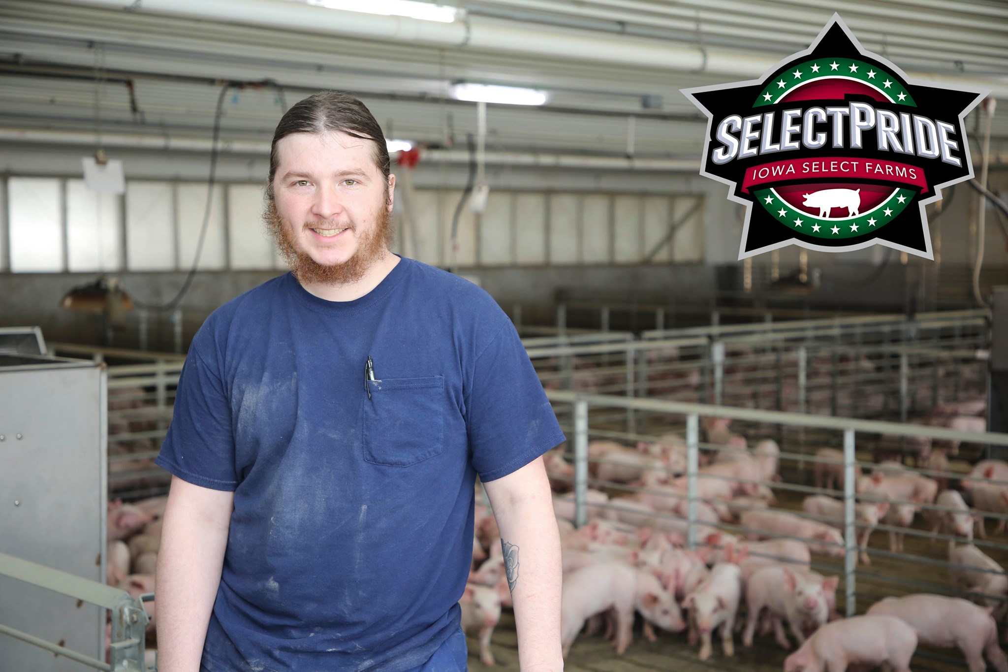 Cody stands in a barn.