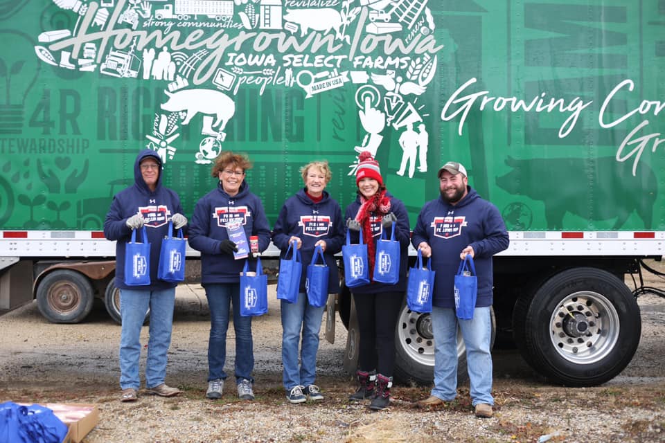 Group of volunteers poses for a group photo.