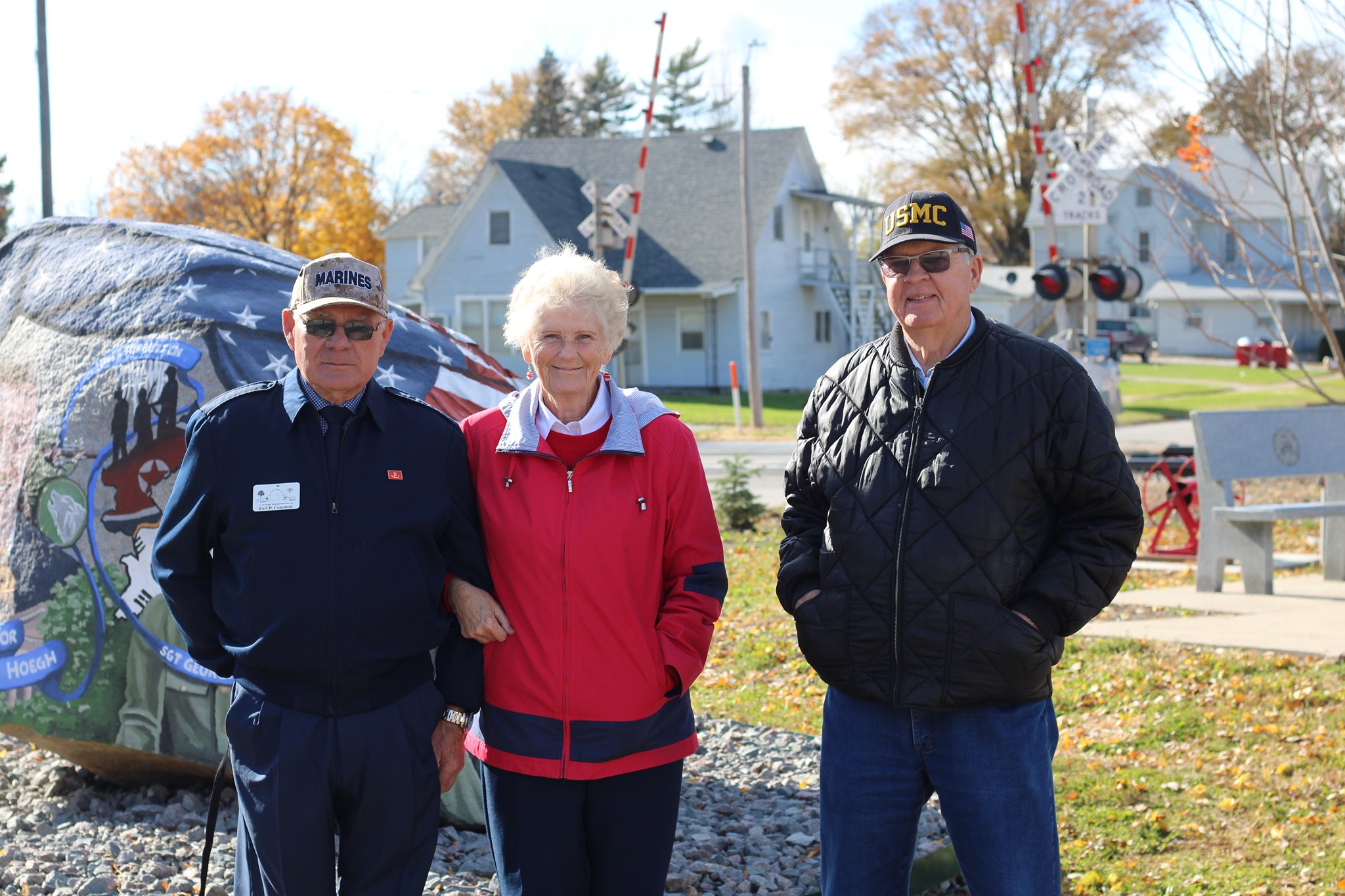 Veterans stand in front of the freedom rock