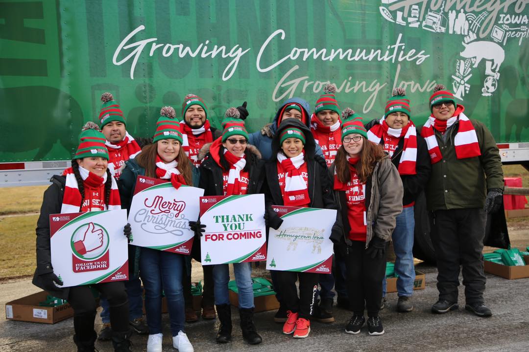 Volunteers pose with signs