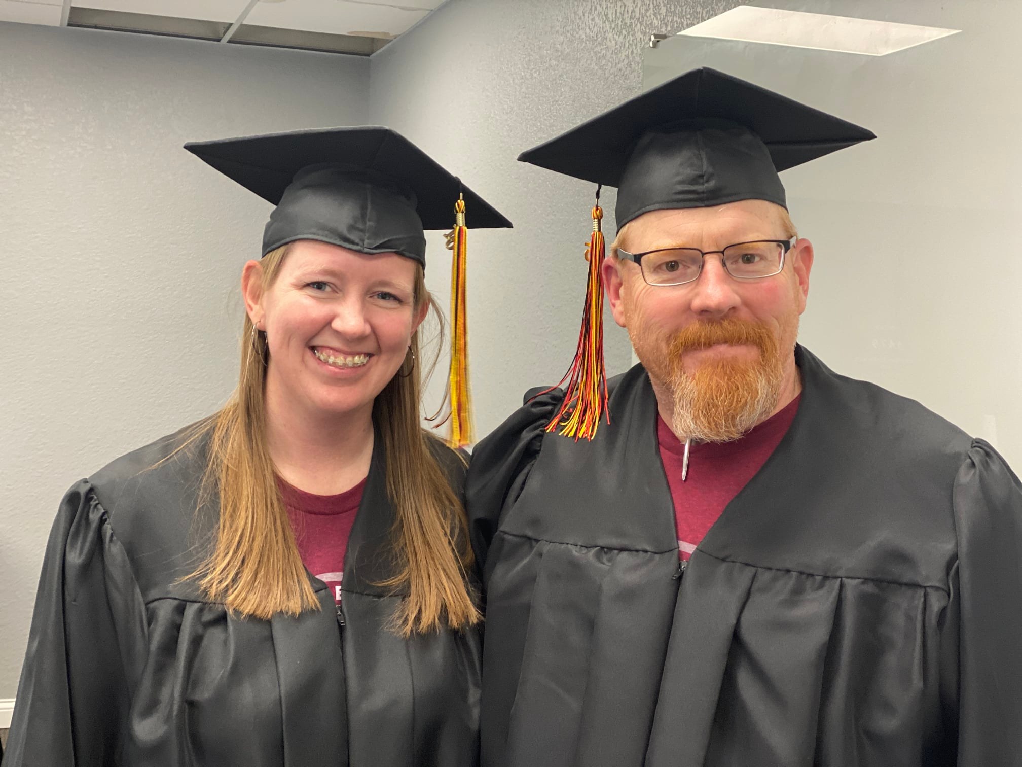 noel and kerry wear graduation attire