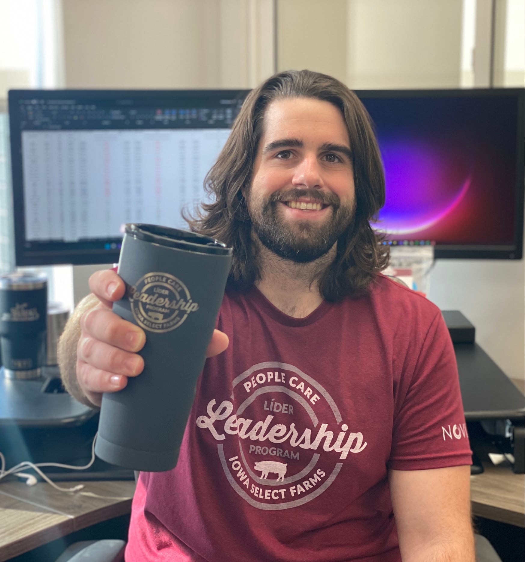 Ben holds a PLP cup