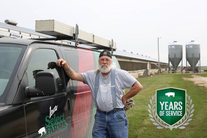 pat poses by his truck