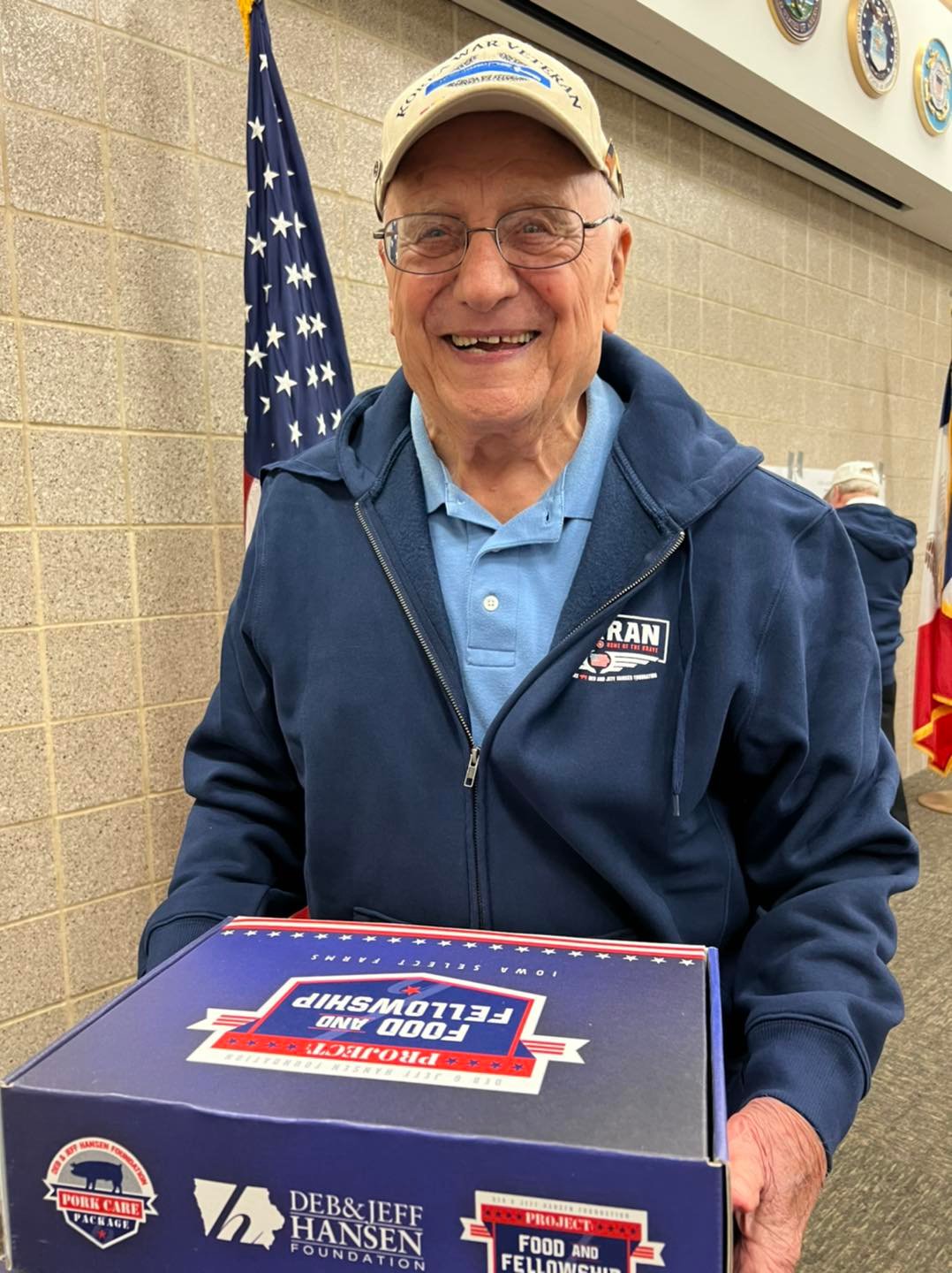 smiling vet wearing one of our sweatshirts