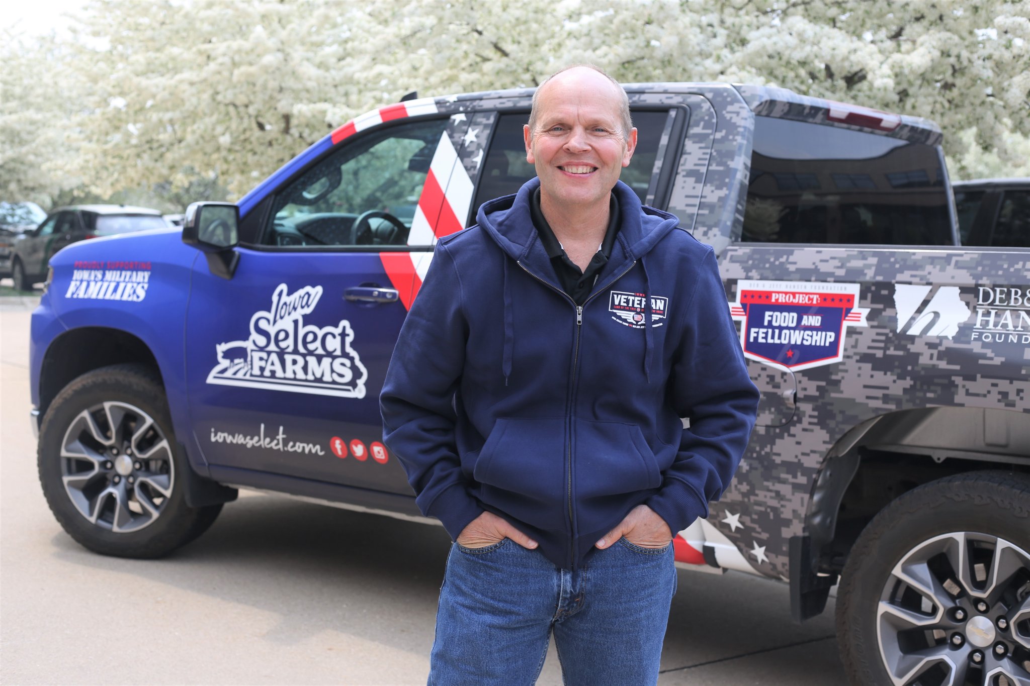 Tim standing next to the military truck