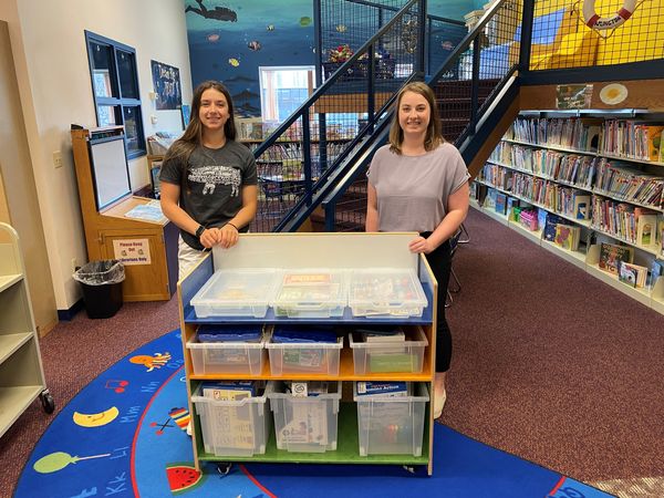 Regan and Alexis with STEM cart