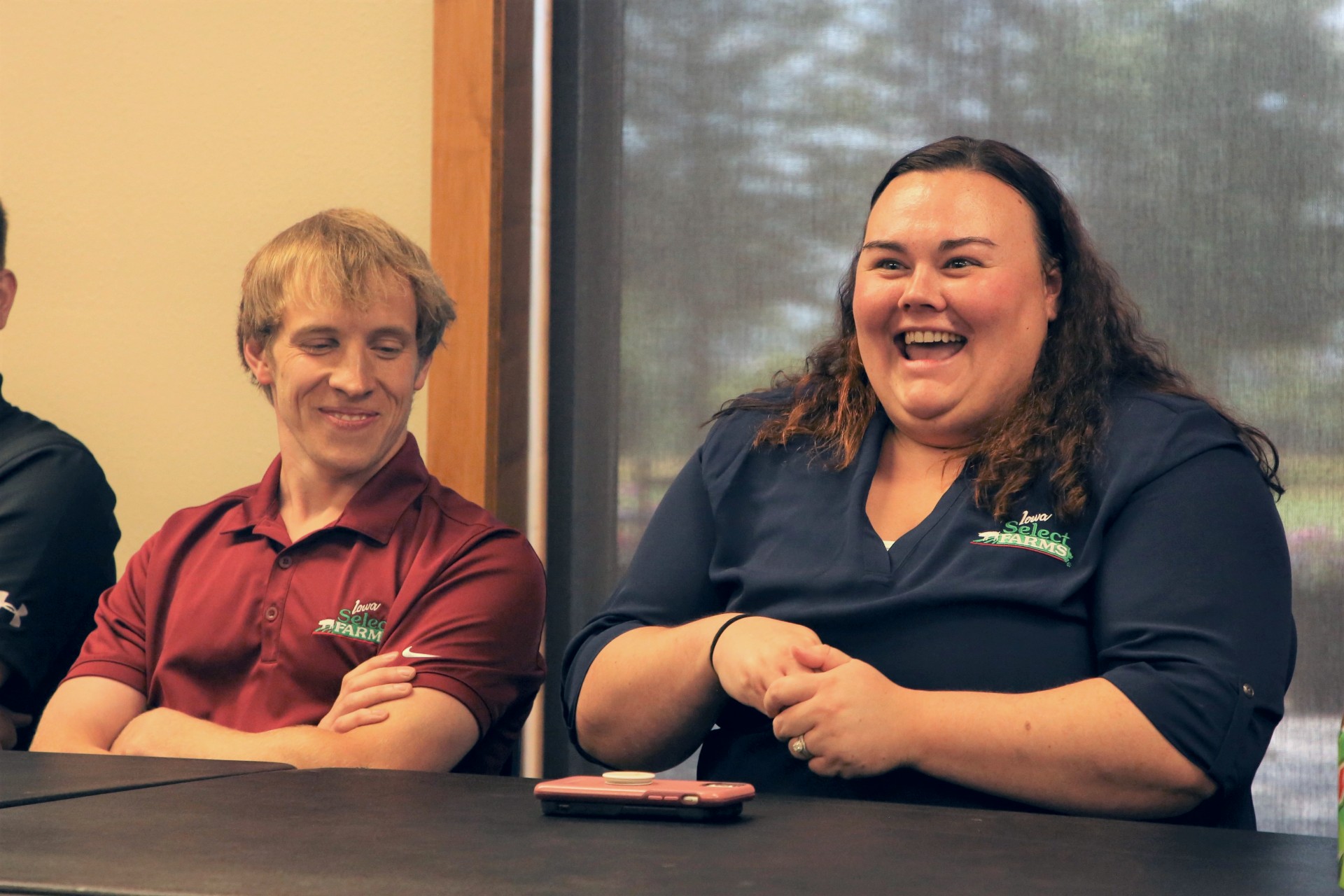 A panel member laughs