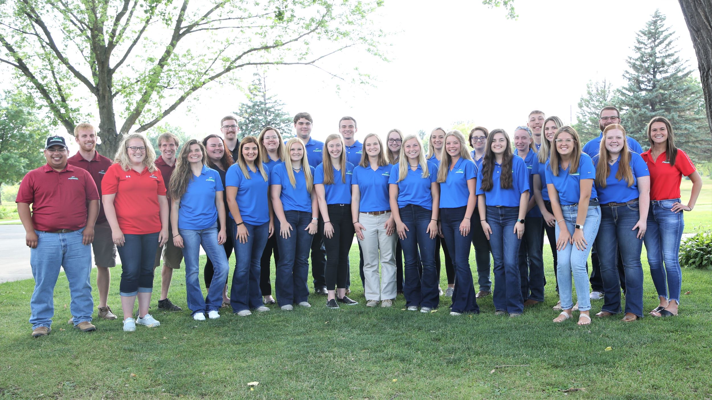 Interns stand with the young leaders panel members.