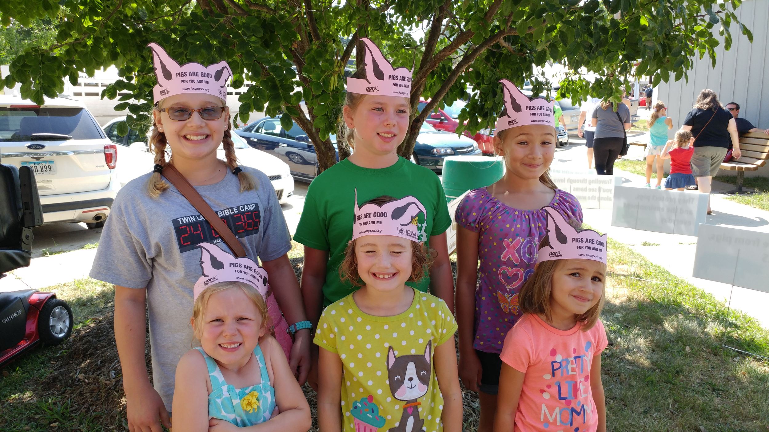 mark's grandkids proudly wear their pig ears