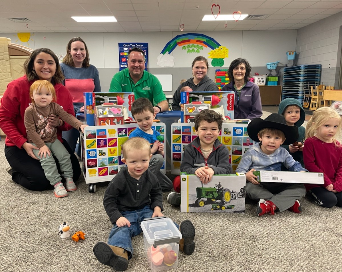a group photo with children and the toybox