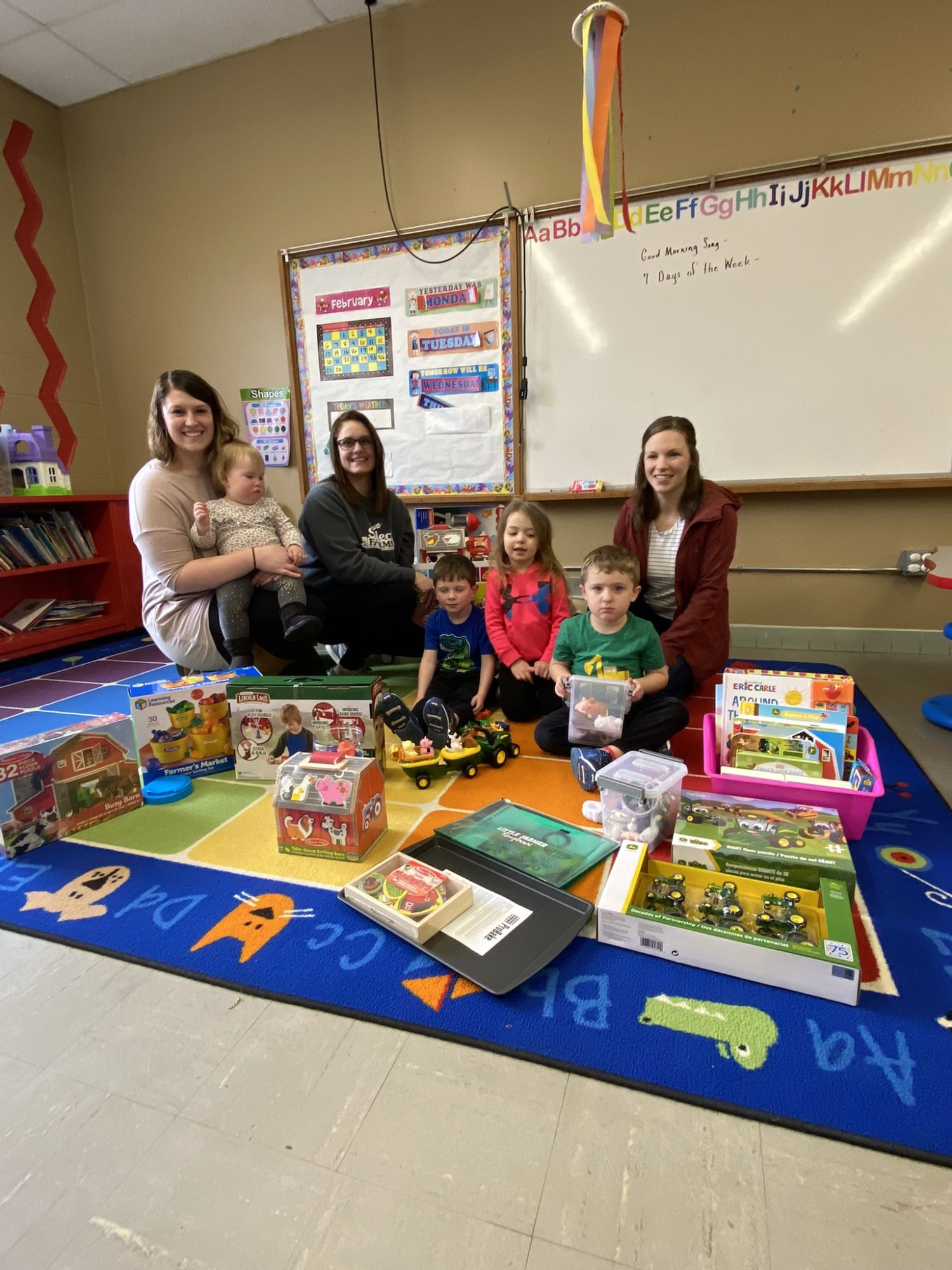group photo with toy box