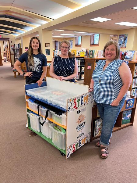 Kendall Young  Pub Library staff with STEM cart