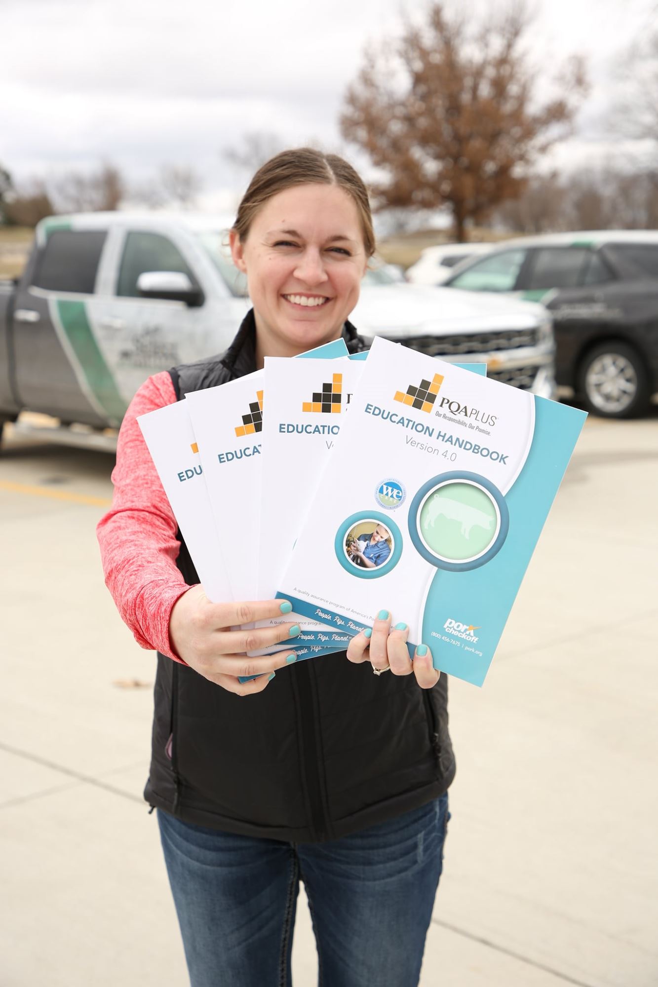 Cassandra holding PQA books