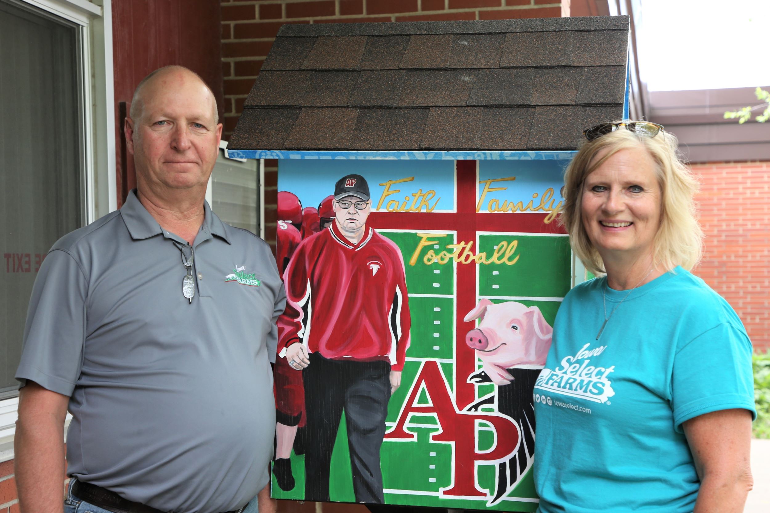 Craig and Nancy pose by their pantry