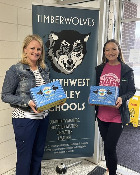 Corning Elem. staff member with Madison holding PS boxes