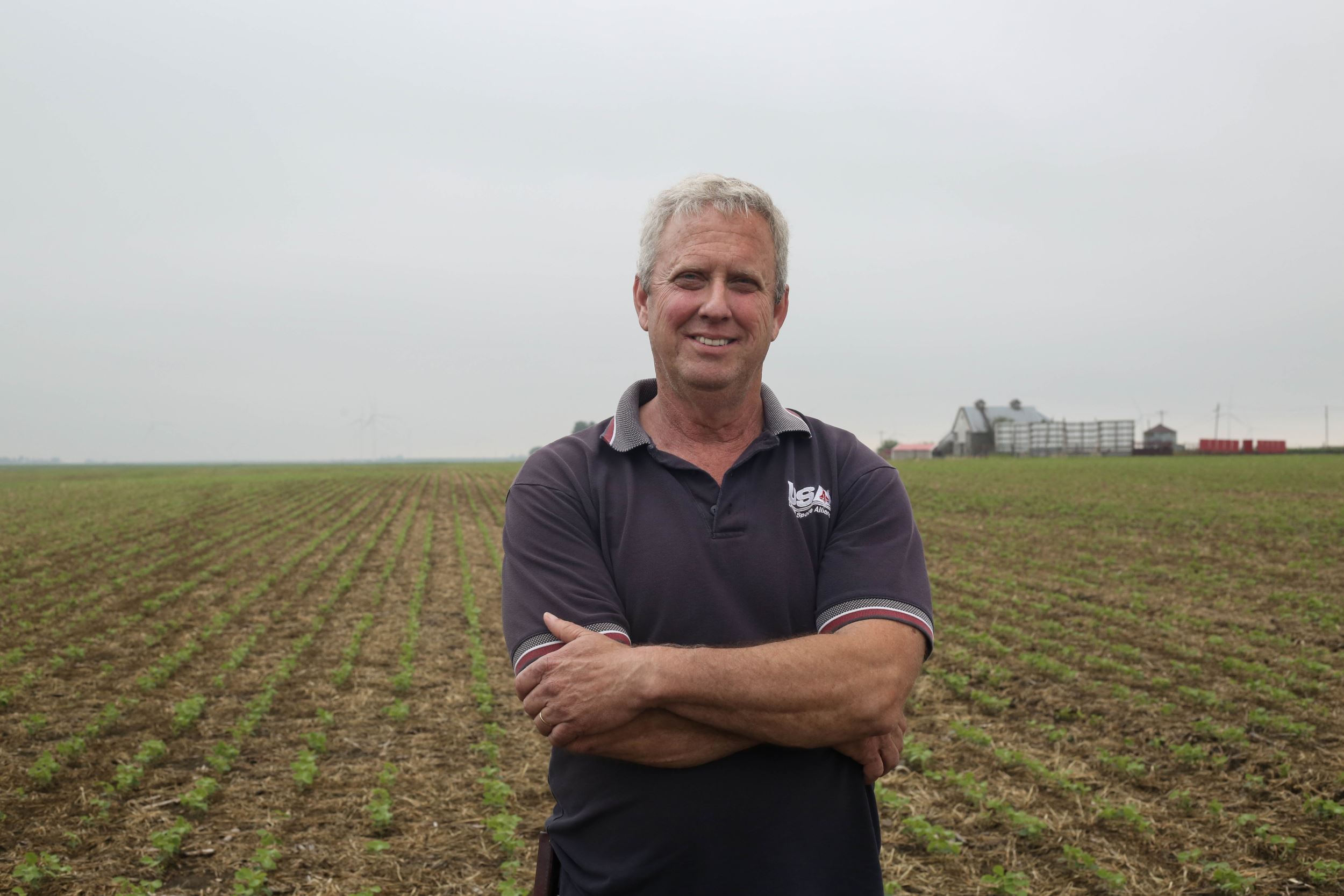 Scott standing in a field.