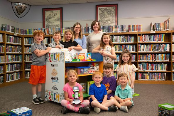 Kids and teachers at Slater Library with STEM cart.