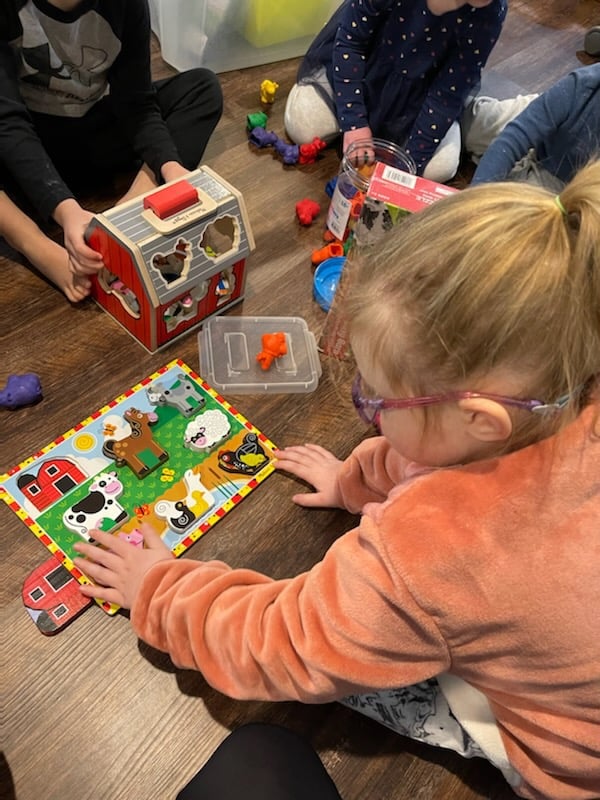 Little girl with puzzle