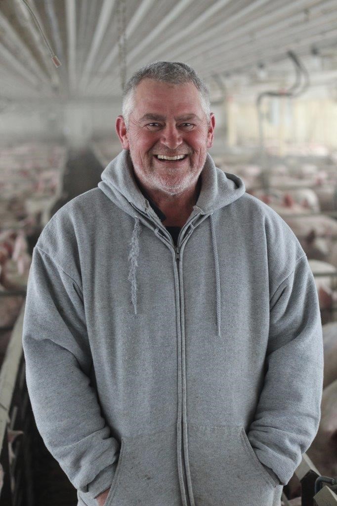 Tony inside a hog bar, smiling