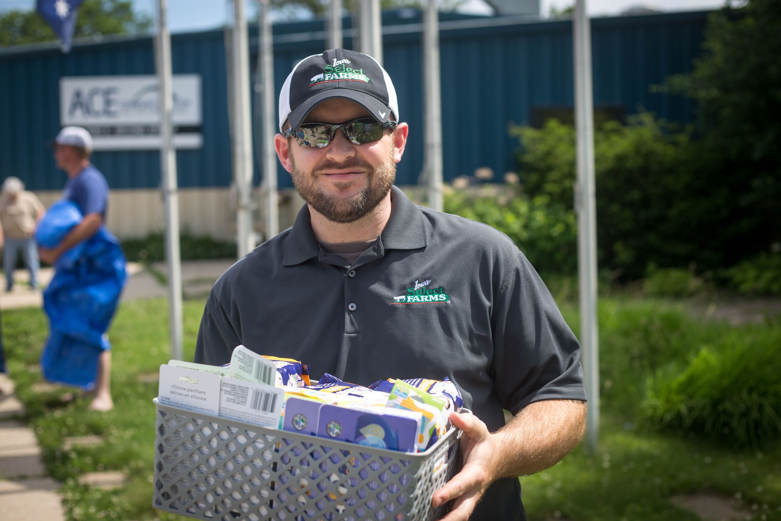 Gerhard holds a box of supplies for his pantry