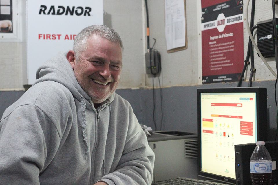 Tony enters production and animal care records into the Tools intranet in the farm's office
