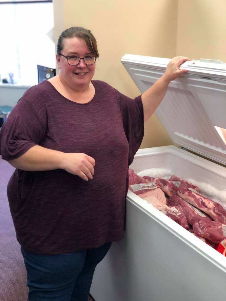 April Kelley by freezer full of pork loins