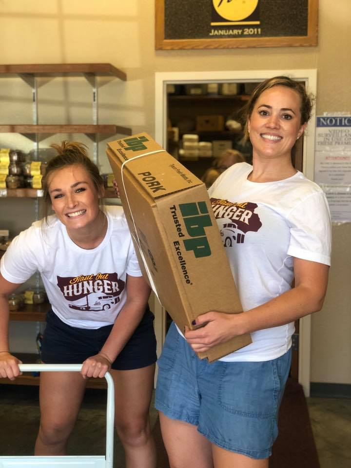 Lexie and Allyson unloading pork loins