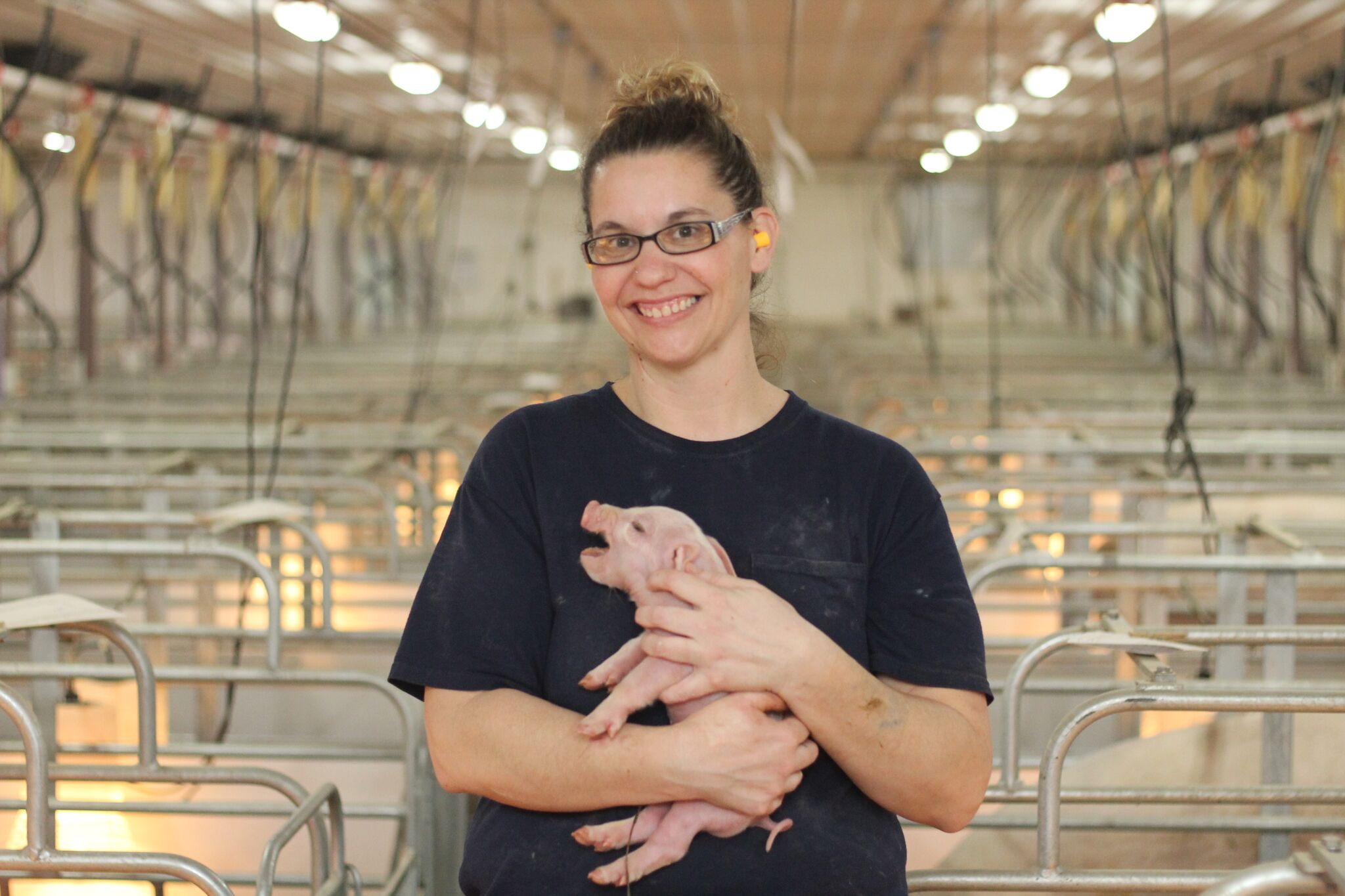 Andrea Graves with piglet