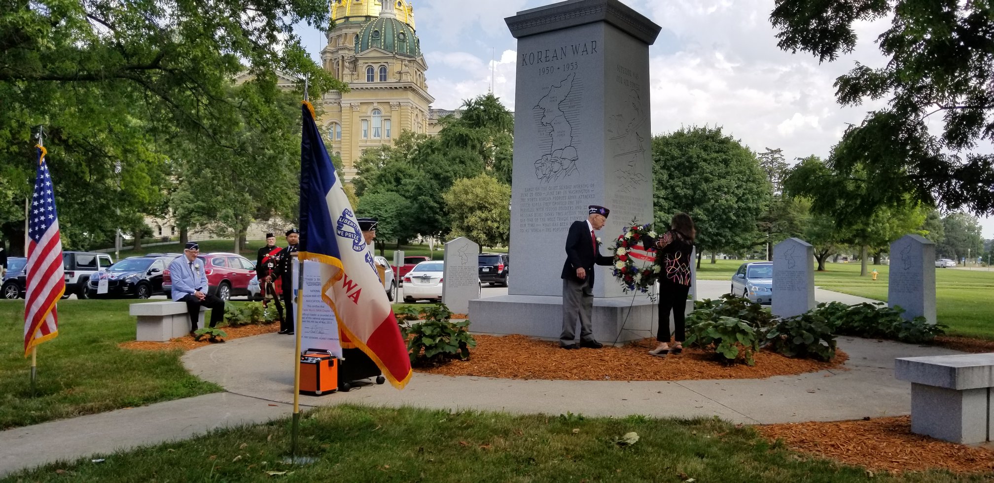 wreath that was laid at the foot of the memorial before a moment of silence and the playing of Taps