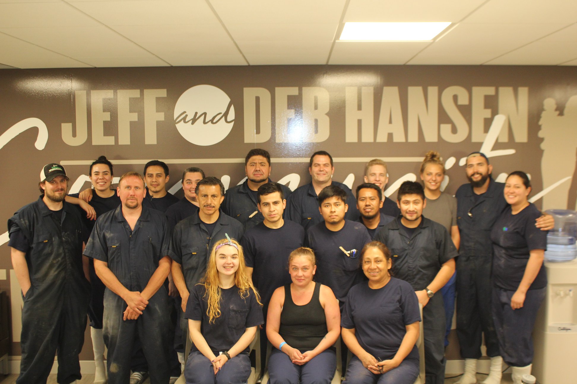 The entire team poses in the breakroom of Yale