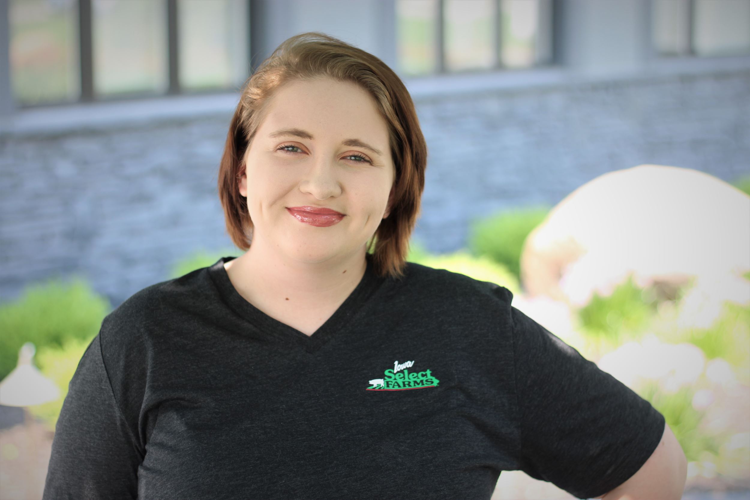 Megan poses for a professional headshot.