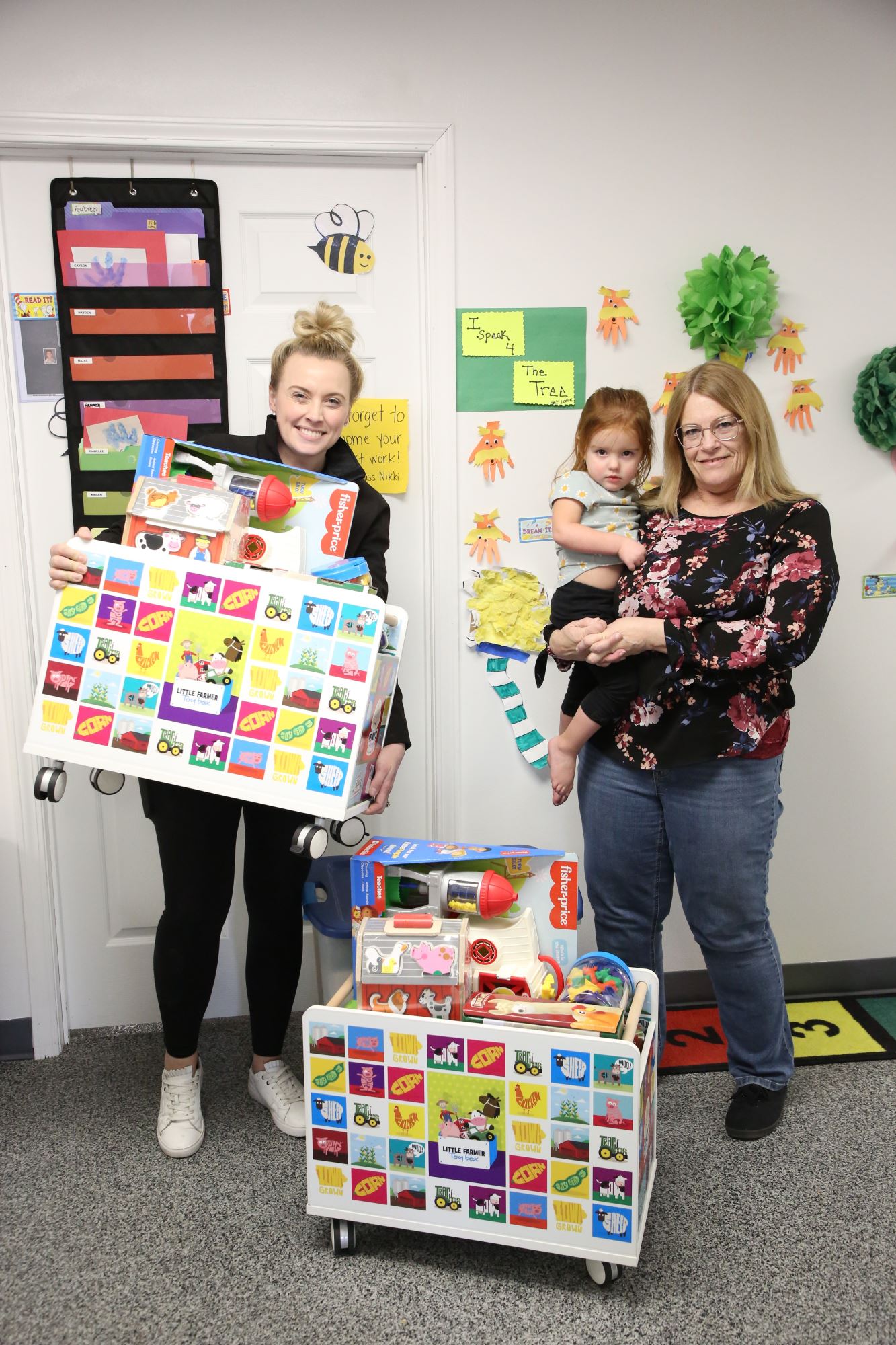group photo with two toy boxes