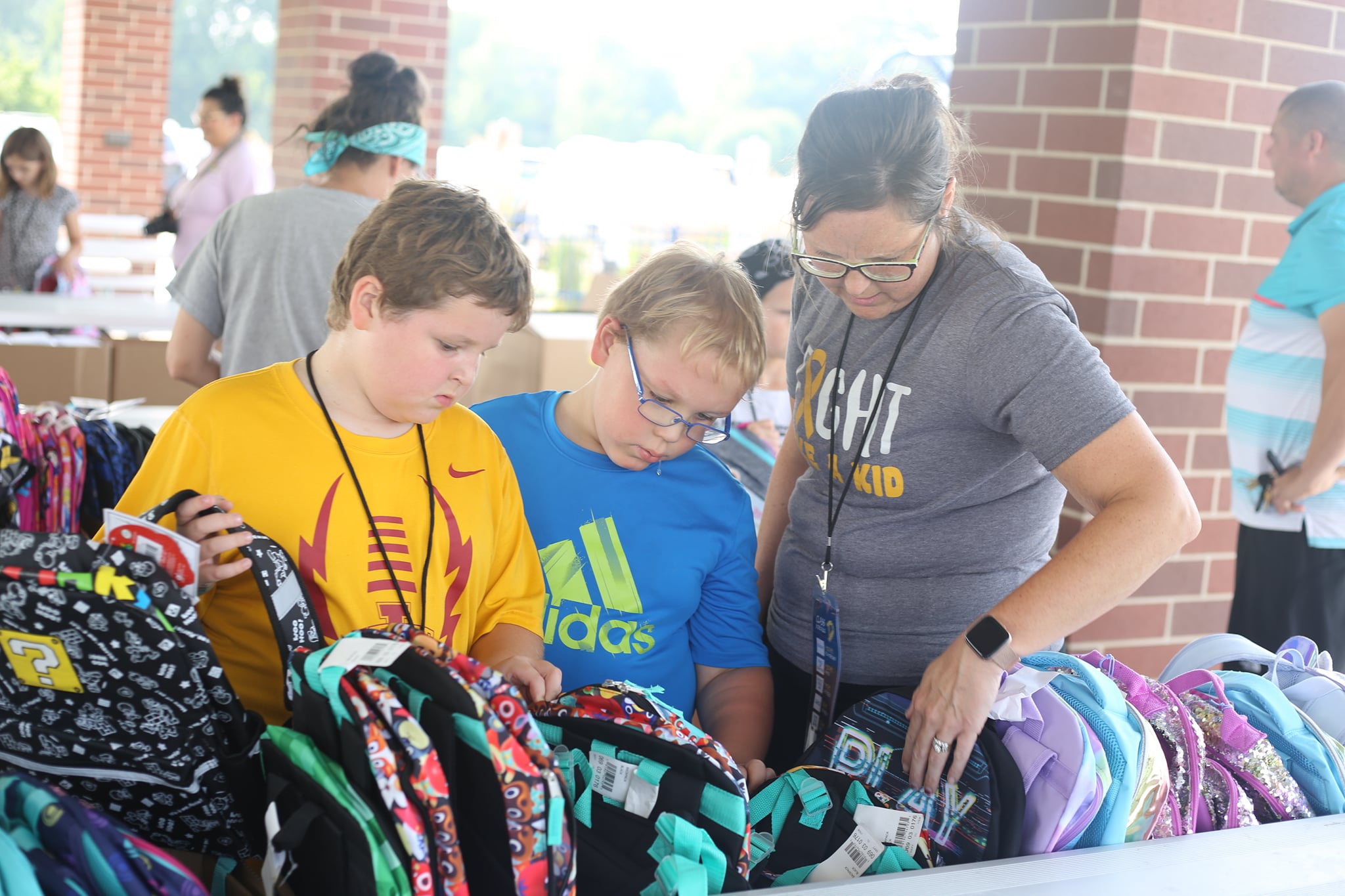 Children browse for school supplies from the Deb and Jeff Hansen Foundation.